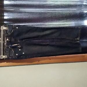 Blue jean pants with stars and words the back
